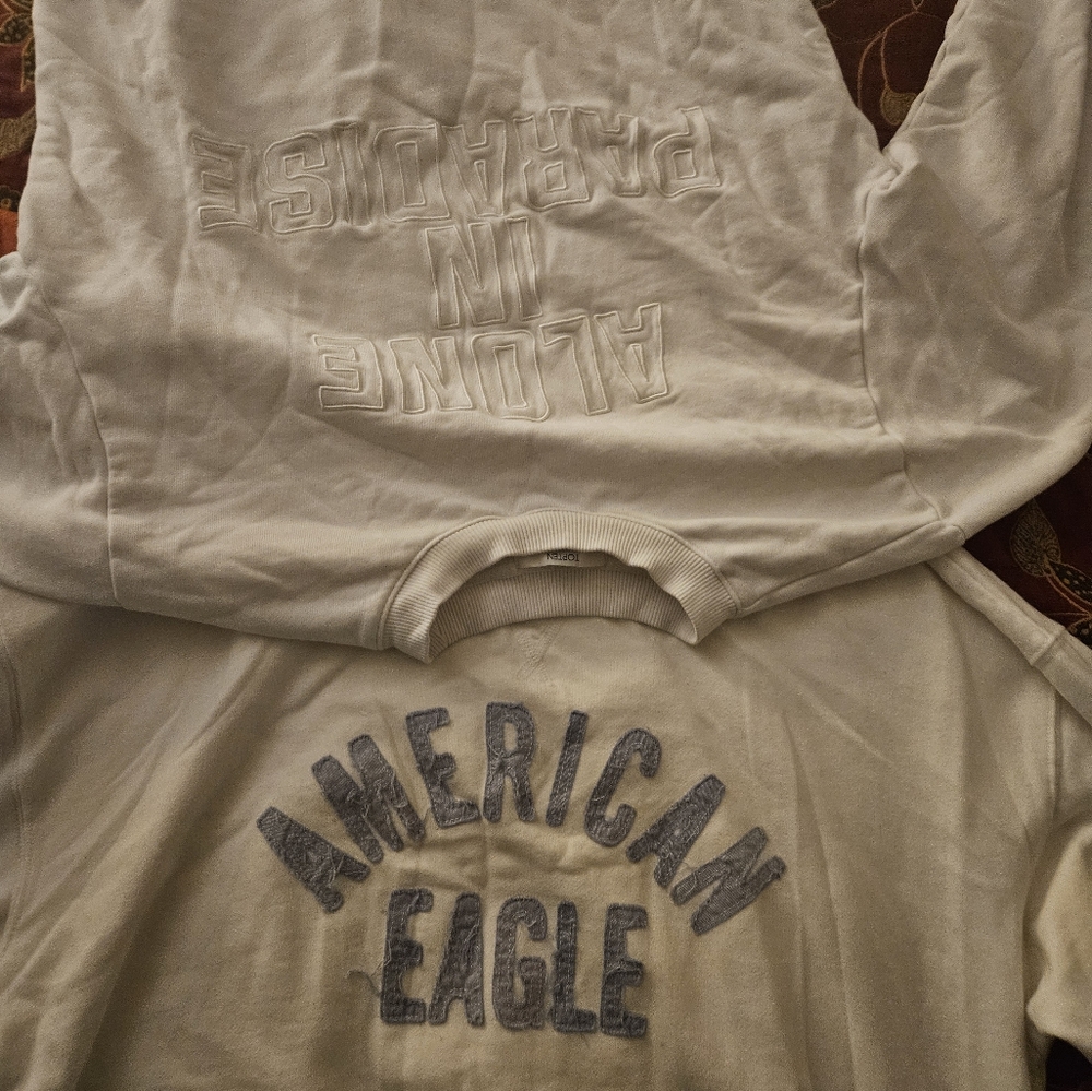 Assortment of sweater shirts from American Eagle, Champions, Meelow